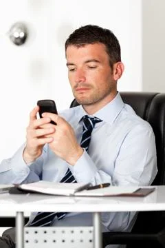 Man reading a message Stock Photos