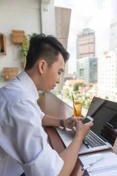 Man reading message on smartphone Stock Photos