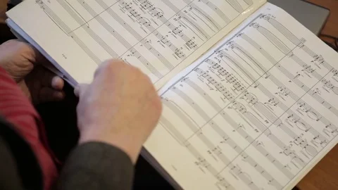 Man reading musical notes Stock Footage 85339362