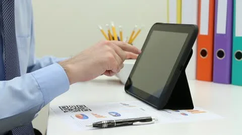 Man reading news on electronic tablet Stock Footage 22008611