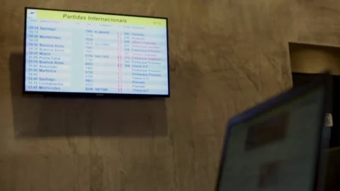 Man reading news on laptop while waiting for a flight in the airport Stock Footage 148698999