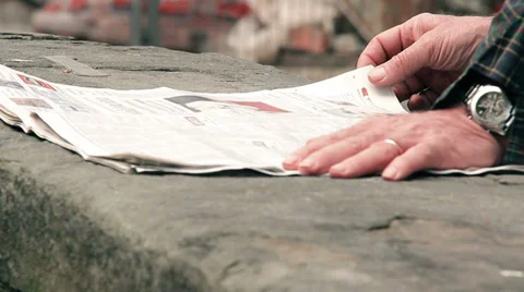 Man reading newspaper, closeup portrait on his hands Stock Footage