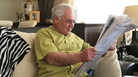 Man reading newspaper 스톡 동영상 49821442