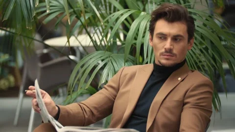 A man reading a newspaper Stock Footage 144453215