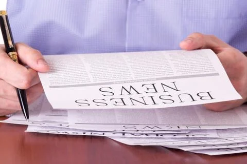 Man reading a newspaper Stock Photos