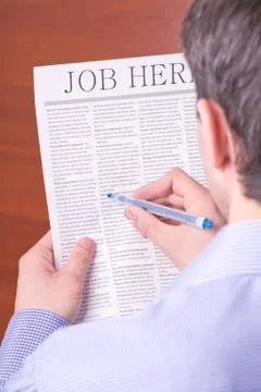 Man reading a newspaper Stock Photos