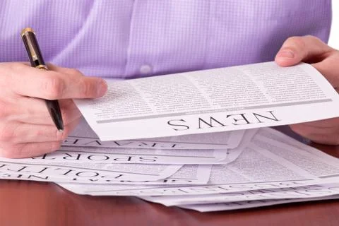 Man reading a newspaper Stock Photos