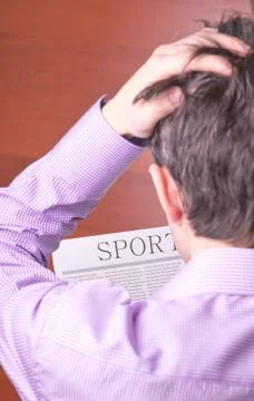 Man reading a newspaper Stock Photos