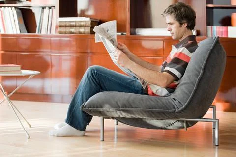 A man reading a newspaper Stock Photos