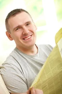 Man reading newspaper Stock Photos