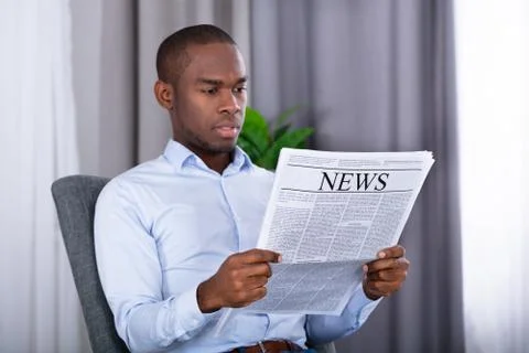 Man Reading Newspaper Stock Photos