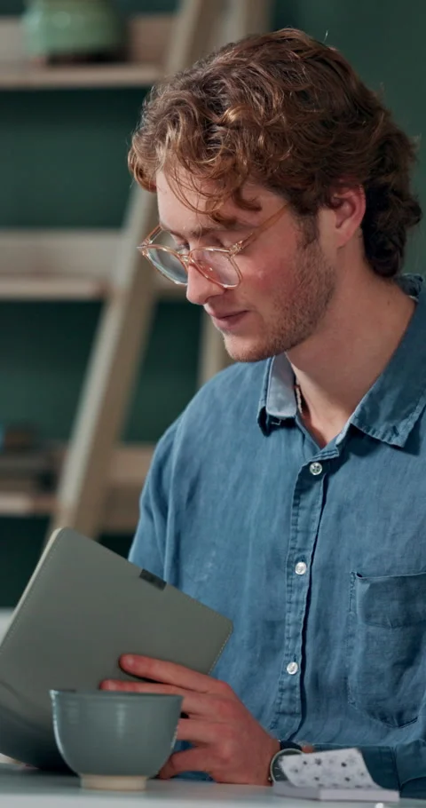 Man, reading notebook and laughing in office for funny plot development Stock Footage 293760853