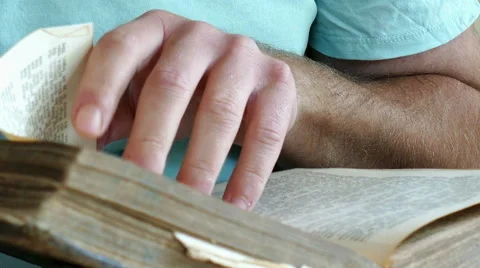 A man is reading an old book Stock Footage 51782772