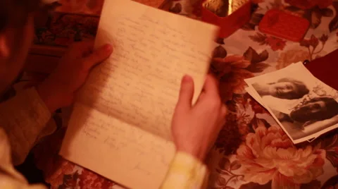 Man reading old letters and looking at old photos Stock Footage 59372521