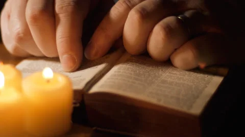Man reading open bible Stock Footage 36199611