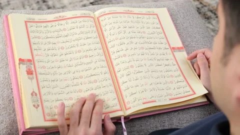 Man reading Quran Stock Footage 233269829