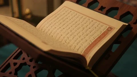 Man reading quran in lectern in place of worship Stock Footage 160051958