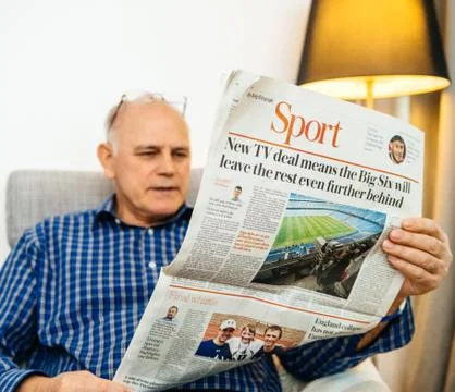 Man reading Sport page with Big-Six news Stock Photos