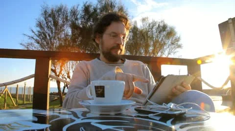 Man reading tablet showing thumb up Stock Footage