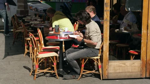 Man reading on terrace, Paris Stock Footage 51386320