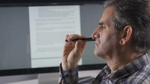 Man reading written document on computer is thoughtful. Stock Footage 224633352