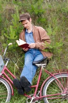 Man reads book Stock Photos