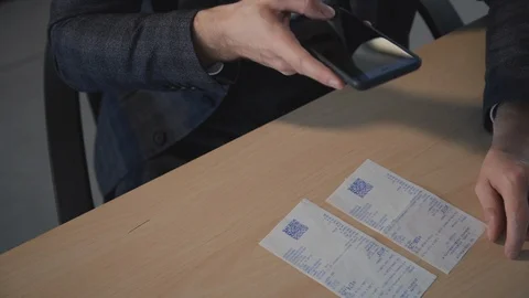 Man reads the check using the application on smartphone. QR code scanning Video stock 119462697