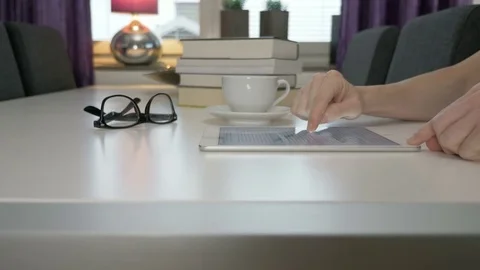 A man reads an ebook on a tablet Stock Footage 82125029