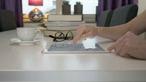A man reads an ebook on a tablet Stock Footage 82125842