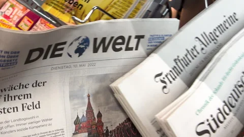 Man Reads German Headlines at Press Stall Stock Footage 306050673
