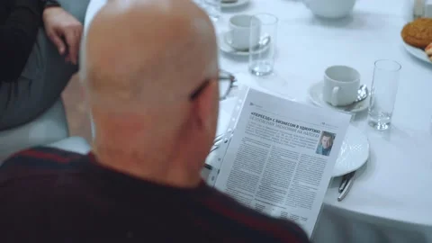 A man reads a newspaper Stock Footage 219962404
