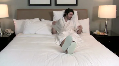 Man reads paper / breakfast in bed V2 - HD Video stock 1004407