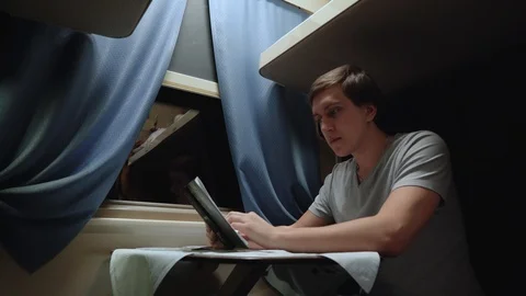 Man reads on the train. 4K Stock Footage 105259550