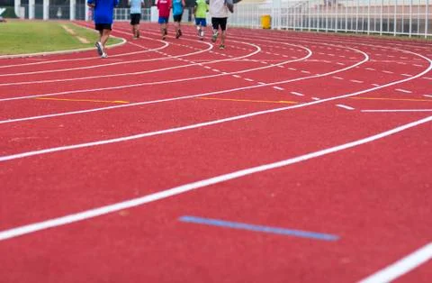 Man ready to start running on running track Stock Photos