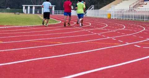 Man ready to start running on running track Stock Photos