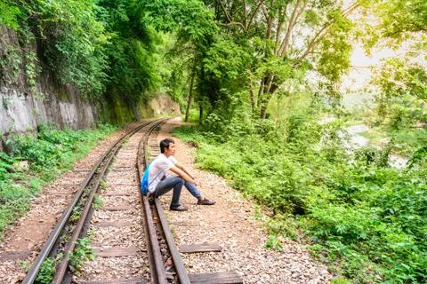 Man recapturing about the World War II at Death Railway, Kanchanaburi Thailand Stock Photos