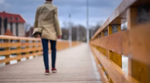 Man Receding Into the Distance Walking Down An Ocean Pier Stock Footage 49759905