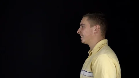 The man received a balloon in the face with water. A young man stands on a black Stock Footage 123313038