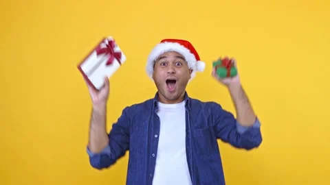 A man received a gift box thrown in. Happy excited asian man in new year's chris Stock Footage 145131879