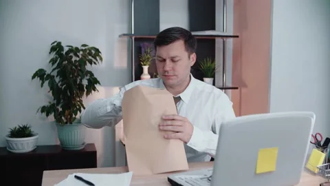 Man receives money in an envelope, opens the envelope and counts the money Stock Footage 146707465