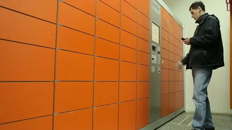 A man receives a package in the mail postal terminal Stock Footage 61390548