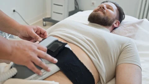 Man Receiving Ems Body Contouring Treatment in Wellness Clinic Stock Footage 337171850