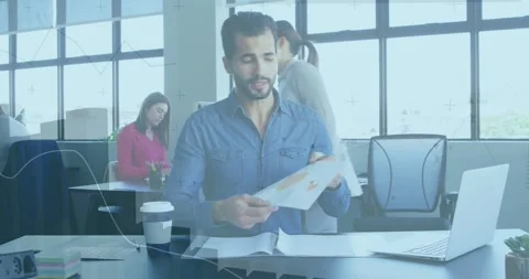 Man receiving report stack, reviewing pages, pointing at charts, reaching Stock Footage 331872694