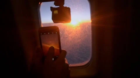 Man record video on the camera from the airplane window 스톡 동영상 102206063