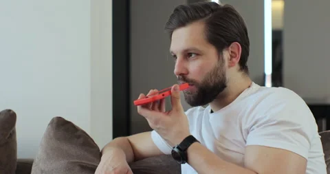 Man recording answering by audio message in social network on mobile phone. Man Stock Footage 269125040
