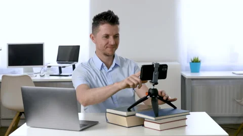 Man Recording Himself On Smartphone In Office Stock Footage 135026928