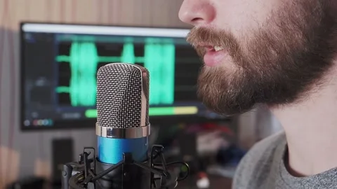 Man recording voice. Microphone with waveform in the background Stock Footage 155488928