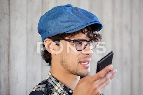 Man recording voice or calling on smartphone Stock Photos