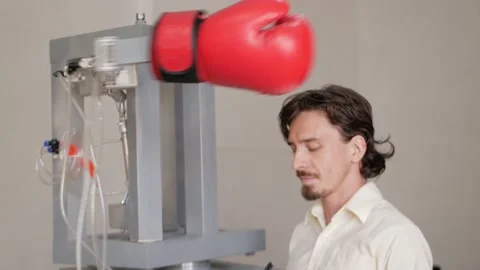 Man records performance of boxer's robot. inventor monitors his device Stock Footage 204970484
