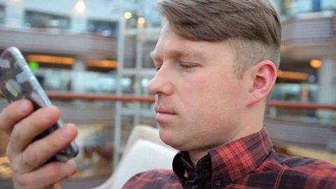 Man records a voice message on a mobile phone Stock Footage 105978055